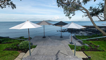 Outdoor Umbrellas A collection of premium outdoor umbrellas from Design Warehouse, elegantly arranged to provide shade and style for patios and outdoor spaces.